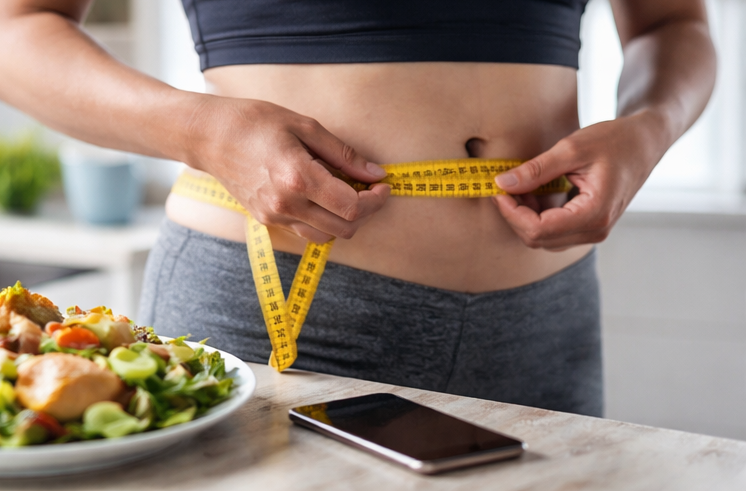 measuring waist with healthy diet